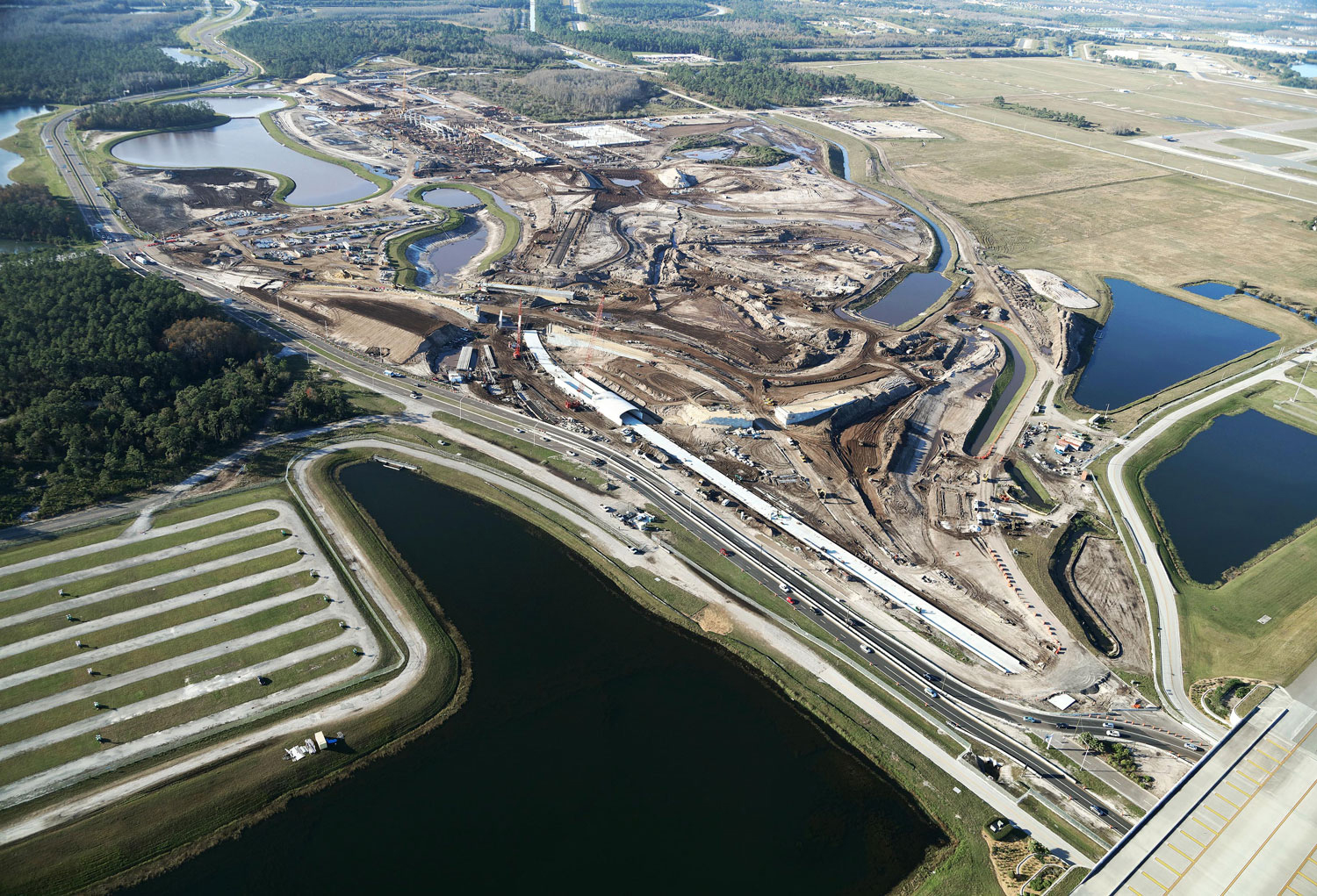 The Orlando International Airport South Airport APM Complex was a bid build awarded to The Middlesex Corporation in 2015 for the Greater Orlando Aviation Authority (GOAA). A joint venture project, The Middlesex Corporation worked as a General Contractor to Hensel Phelps. The project included pond construction, storm water, and erosion control, and construction on roads, bridges, and MSE walls.