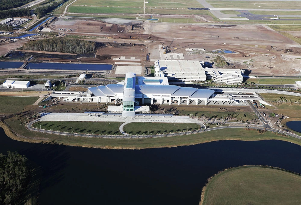 The Orlando International Airport South Airport APM Complex was a bid build awarded to The Middlesex Corporation in 2015 for the Greater Orlando Aviation Authority (GOAA). A joint venture project, The Middlesex Corporation worked as a General Contractor to Hensel Phelps. The project included pond construction, storm water, and erosion control, and construction on roads, bridges, and MSE walls.