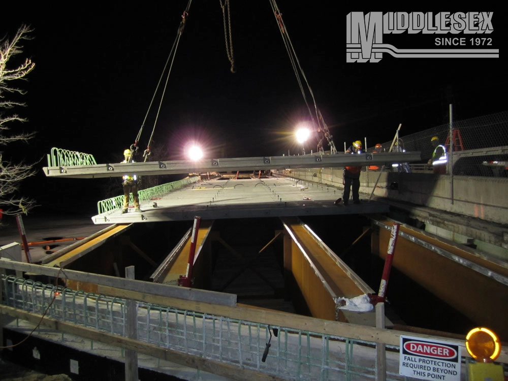 The I-495 Lowell Bridge Bundle, a Design-Build, was completed in 2011 for the Massachusetts Department of Transportation (massDOT). The project included the design and replacement of six bridges carrying I-495 northbound and south bound over the Concord River, the MBTA commuter rail tracks, and Woburn Street in Lowell, MA.