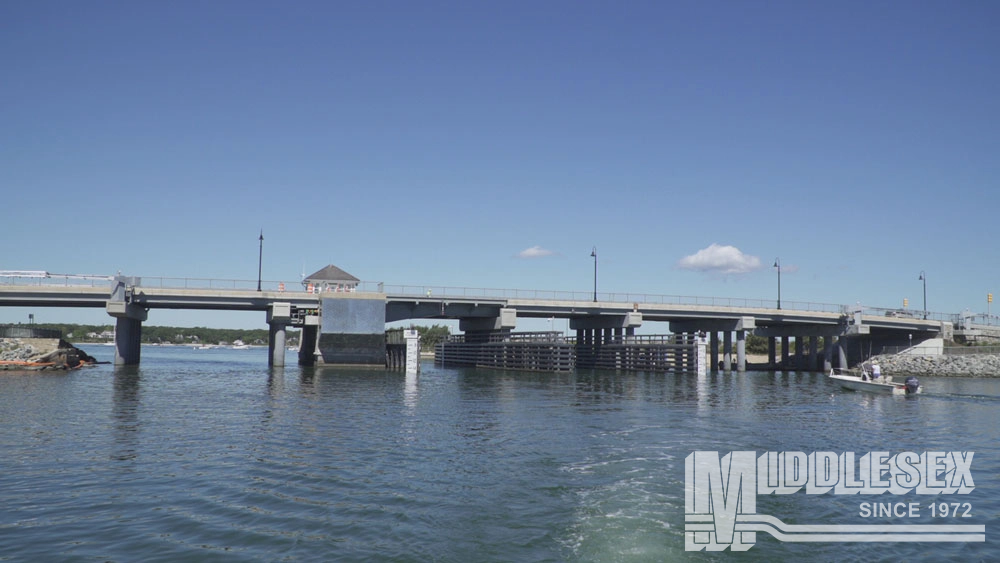 The drawbridge replacement on Beach Road over Lagoon Pond project involved the replacement of the current temporary steel bascule bridge with a new, 7-span bascule bridge.