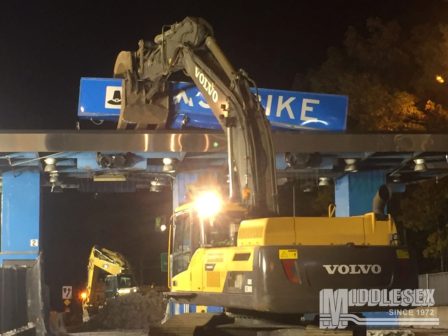 The I-90 Toll Plazas Demolitions/Ramp Reconstruction project was a bid build located in Hampden County, MA. The project was started in 2016 and was completed in 2017 for the Massachusetts Department of Transportation (massDOT). The project included the demolition and reconstruction of the Westfield, West Springfield, Chicopee, Ludlow, and Palmer electronic toll plazas on I-90.