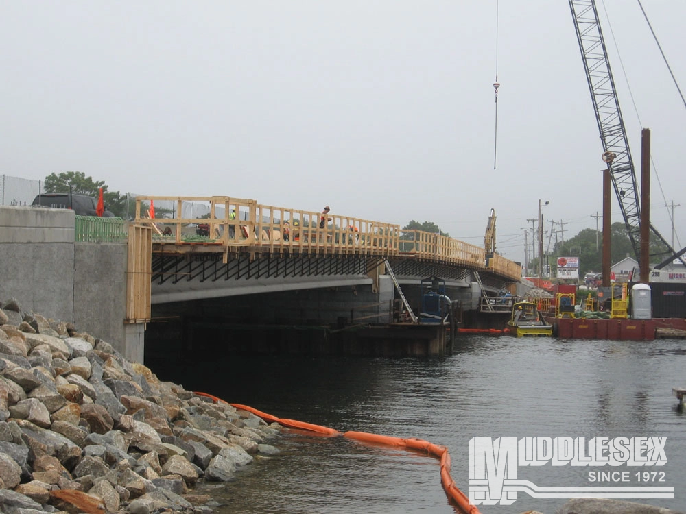 The William H. Dalton Memorial Bridge carries US Route 6/ State Route 28 (the Cranberry Highway) over Cohasset Narrows at the Bourne – Wareham Town Line. The Middlesex Corporation was awarded this job by the Massachusetts Department of Transportation, (MassDOT). The Middlesex Corporation replaced the existing structure with a 350’-long 3-span bridge.