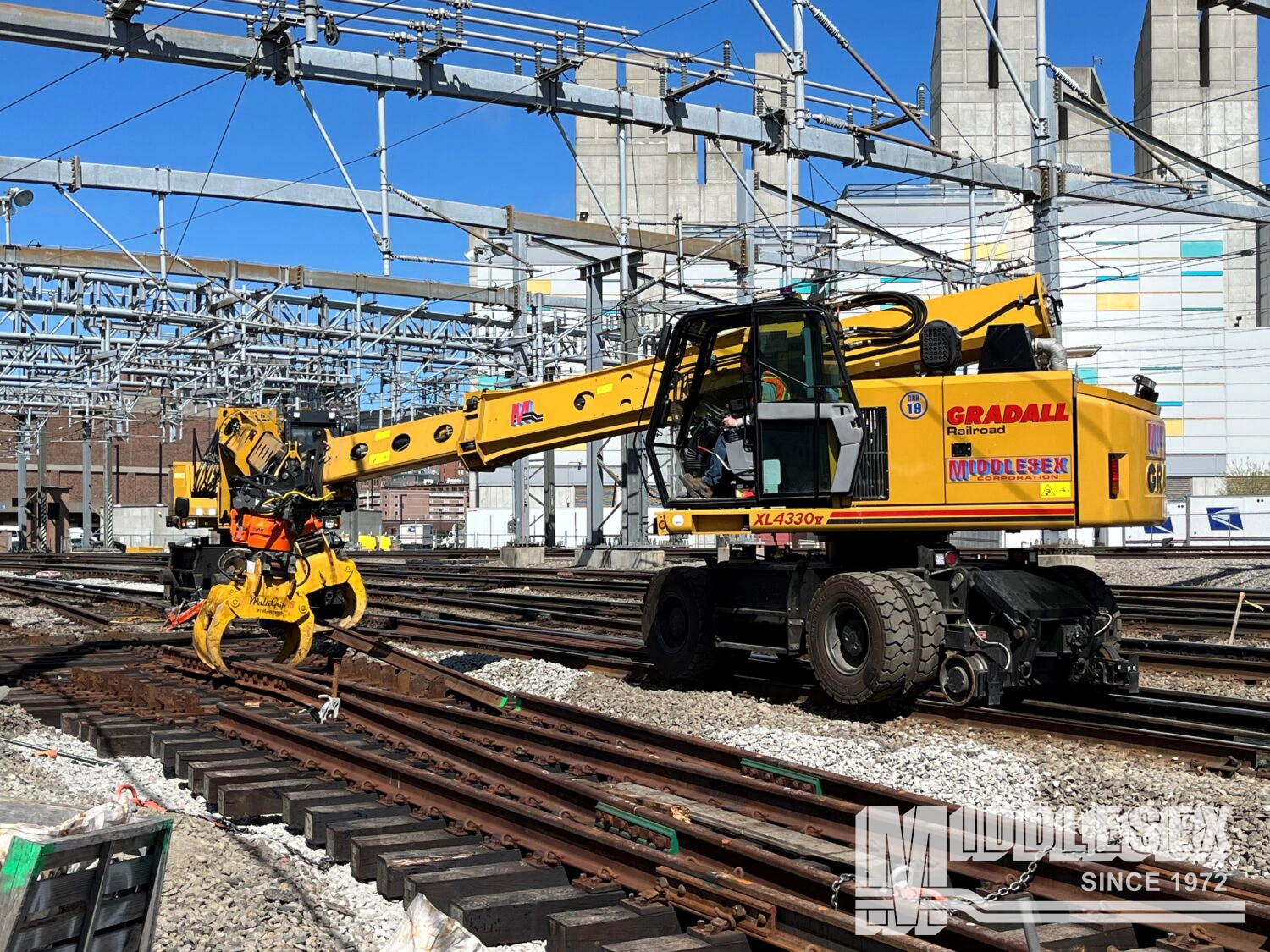 The Middlesex Corporation is rebuilding and upgrading the South Station Tower 1 Interlocking for the Massachusetts Bay Transportation Authority (MBTA) in Boston, MA. The bid build project includes replacement of trackwork, installing the foundation and platform work for a new central instrument house, upgrading the existing relay-based signal system, replacing the existing back-up power generator, installing new lights and floodlights, additions to the communication and security systems, and the replacement of trackwork and associated signal infrastructure within the cove interlocking area.